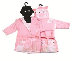 two children's bathrobes in pink and black with pigs printed on them