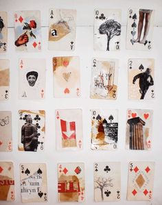 playing cards are arranged on a white surface