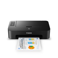 a canon printer is sitting on top of a piece of paper that has been placed in front of it