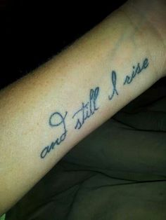 a person with a tattoo on their arm that says, and still i rise written in cursive font