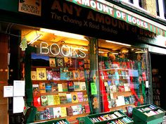 there are many books on display in the store window and it's all different colors