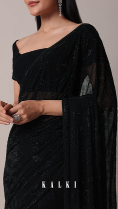 Up the glamous quotient at the upcoming cocktail party by donning this bold black saree. Adorned with all-over sparkly Swarovski embellishments, it is crafted from opulent georgette fabric. Completed with an unstitched blouse piece, this drape is an ideal pick for casual and formal occasions. Embellished Black Pre-draped Saree For Party, Black Embellished Saree For Party Wear, Black Embellished Saree For Eid, Glamorous Black Saree With Sequins, Designer Black Embellished Saree, Black Georgette Saree, Farewell Sarees, Business Woman Quotes, Fancy Sarees Party Wear