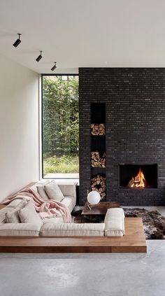 a living room with a fire place and couches