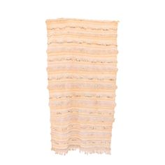 a piece of cloth with fringes on it, against a white background and in the middle there is an empty space for text