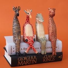 Set of giraffe, alligator, zebra and cheetah sitting sculptures. Each sculpture measures 8" height, 2.5" length and 2.5" width. Painted with real life details. Handcarved from jacaranda wood. Made in Kenya. ---------------------------------Wood carving provides artisans in Africa with a sustainable source of income for their craftsmanship. We source products from wood workshops across Rwanda, Kenya and Ghana. In Kenya, wood carving is practiced by the Kamba tribe. Wood carving is a part of Kamba Cheetah Sitting, Sitting Sculpture, Animal Sitting, Zebra Decor, Olive Wood Bowl, Believe God, Wine Bottle Topper, Source Of Income, Plant Book