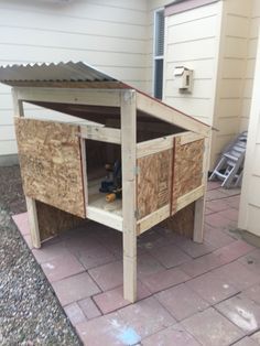 an outdoor storage shed with the door open