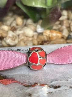 Authentic and retired Pandora Red hot Love hearts charm on ribbon in a gift box with tissue and box sticker.  A beautiful charm used to create a bracelet full of memories.  Just part of my collection that set in my velvet lined jewelry box. Professionally cleaned and in new condition.  This item will ship USPS same day as purchase.  Please see all photos as trademarks have been photographed and shown in every listing as proof of authenticity.  A gorgeous piece to add beauty to any Pandora bracelet.  .  If you have any questions feel free to ask.  Happy Etsy shopping! Valentine's Day Heart Charm Gift, Heart Pendant Charms As Gift, Valentine's Day Gift Bracelets With Charms, Heart-shaped Charms With Heart Beads For Gift, Elegant Hypoallergenic Charms For Gifts, Hypoallergenic Keepsake Jewelry For Valentine's Day, Pink Charms For Valentine's Day Anniversary, Pink Charms For Anniversary On Valentine's Day, Personalized Charms For Valentine's Day Gift