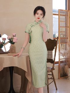 Indulge in the exquisite elegance of this lace cheongsam dress. Featuring soft lace fabric , small flower appliques, traditional mandarin collar, two side slits, creating a timeless and sophisticated silhouette, perfect for any special occasion. Size Guide: Please refer to the size guide picture before placing the order. Please leave your Height, Weight , Bust, Waist and Hip measurements in the Personalisation box so we could double check the size for you. Elegant Floral Embroidered Dress With Stand Collar, Elegant Embroidered Cheongsam With Stand Collar, Elegant Fitted Cheongsam With Floral Embroidery, Fitted Floral Embroidery Cheongsam, Traditional Short Sleeve Fitted Cheongsam, Formal Embroidered Fitted Cheongsam, Traditional Cheongsam With Floral Embroidery, Fitted Dress For Tea Ceremony, Fitted Embroidered Ao Dai With Stand Collar