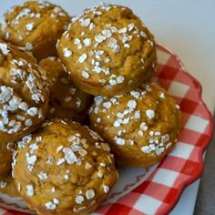 a plate full of muffins with sesame seeds on top