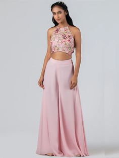 A two-piece light pink flared pant set from the Suruchi Parakh collection. This beautiful light pink flared pant is paired with a hand-embroidered padded crop top. The light pink color with sequin, and threadwork enhance the graceful flared pant set in georgette crepe fabric. The printed top has intricate floral embroidery with sequins work. And also, the crop top has a tie-up at the back. Traditional Crop Top And Pant, Top And Plazo Indian, Plazo With Crop Top Western, Blouse And Plazo Set, Flared Plazo Designs, Plazo Top Western, Plazo And Top Western, Palazoo Sets Crop Tops, Plazo And Top