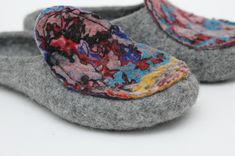 Felted slippers for women - excellent gift for birthday or housewarming These cute grey slippers are decorated with colored handmade felt sewed on. They are all fully handmade. PLEASE NOTE: all slippers will differ, decoration can have another coloration or scale. Each pair is one of a kind. Felt is a perfect material for footwear. It is extremely wear proof and warm. When you put them on, you won't want to take the slippers off. They will definitely make a part of your home outfit. Non-slip sol Comfortable Multicolor Slip-on Slippers, Multicolor Non-slip Slip-on Slippers, Multicolor Non-slip Flat Slippers, Gray Non-slip Closed Toe Slippers, Multicolor Slip-on Slippers For Indoor, Handmade Comfortable Slippers With Round Toe, Handmade Round Toe Slippers For Gifts, Handmade Slip-on Slippers As Gift, Handmade Casual Slippers As A Gift