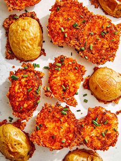 some fried food is laying out on a white paper towel and it looks like they are ready to be eaten