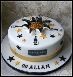 a white cake with gold stars on it