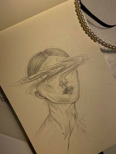 a drawing of a woman wearing a hat