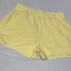 The Breeze Short - Ray Size: Xl Never Worn/New With Tags Running Shorts With Inside Lining Athleisure Athletic Shorts For Beach In Spring, Spring Beach Athleisure Athletic Shorts, Spring Beach Athletic Shorts, Yellow Stretch Shorts For Vacation, Yellow Athletic Shorts With Built-in Shorts For Spring, Summer Workout Shorts With Pockets, Summer Workout Athletic Shorts, Solid Athletic Shorts For Spring Vacation, Yellow Summer Workout Shorts