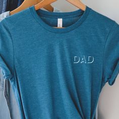 Dad Pocket Tshirt, Funny dad shirt, Fathers Day Gift, New Parents, Gift for Dad, funny Dad Tshirt, Trendy larger sizes available upon request ----ABOUT OUR TEES----- Our tees fit like a well-loved favorite, featuring a crew neck, short sleeves and designed with superior Airlume combed and ring-spun cotton that acts as the best blank canvas for printing. Key Features: - Heat transfer vinyl print - Retail fit - Side seamed - Shoulder taping - Fitted at bicep - Tear-away label - Unisex, women, yout Blue Relaxed Fit T-shirt For Father's Day, Father's Day Family Cotton T-shirt, Blue Tops With Text Print For Father's Day, Father's Day Gift Tops With Letter Print, Blue Cotton T-shirt For Father's Day, Father's Day Blue Short Sleeve Tops, Pre-shrunk Blue T-shirt For Father's Day, Blue Pre-shrunk T-shirt For Father's Day, Father's Day Casual Pre-shrunk Shirt