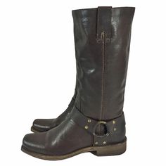 "FRYE HARNESS BROWN Leather Motorcycle Boots Women's Size 6 Retail Price: $298.00 Style No: Biker Motorcycle ITEM DESCRITION: The classic Harness look combines with the added appeal of a belt buckle detail to offer tremendous style. FEATURES AND DIMENSIONS: Color: Tan 100% Leather Leather and Rubber sole Shaft: 12\" Heel: 1\" Highest Quality Material ITEM CONDITION: Excellent Pre Owned Condition ABOUT THE FRYE COMPANY: Frye Company was founded in 1863 by John A. Frye, a shoemaker from England. F Brown Snip Toe Moto Boots For Riding, Western Moto Boots With Leather Lining For Riding, Western Moto Boots For Riding With Leather Lining, Brown Moto Boots With Leather Lining For Ranch, Bike Boots, Frye Harness Boots, Womens Tall Boots, Leather Motorcycle Boots, Women's Motorcycle Boots