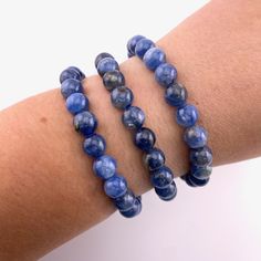 This listing is for one (1) QUALITY Blue Kyanite bracelet. These are stock photos in which you will be hand selected a bracelet. You will receive one that is similar to the ones pictured.  These are one size: "one size fits all" These are best suited for wrists measuring 5.5-7 inches in diameter. They do stretch quite a bit past that as well (if needed). (I have quite small wrists and they fit me fine, they are not too loose though; my wrists are shown in the picture). They are strung on elastic Blue Crystal Bracelet With Stackable Round Beads, Everyday Blue Stretch Bracelet With Gemstone Beads, Everyday Blue Gemstone Beads Stretch Bracelet, Blue Sodalite Bracelets For Gift, Sodalite Round Beads Bracelets As Gifts, Sodalite Bead Bracelets As Gift, Sodalite Round Beads Bracelets For Healing, Blue Hand-strung Sodalite Bracelet, Hand-strung Blue Sodalite Bracelet