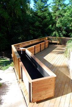 a wooden deck with a water feature on it