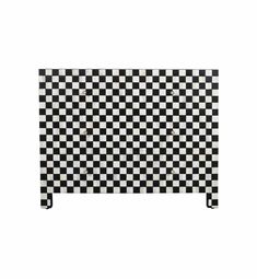 a black and white checkerboard pattern on the back of a headboard with metal legs