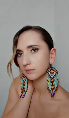 Long Dangle Earrings inspired by Native Americans, designed by me. These unique earrings are handmade with main turquoise color and outstanding matching colors to make them look outstanding. https://www.etsy.com/listing/903391212/native-america-style-bead-earrings?ref=shop_home_active_33&frs=1 Handmade Southwestern Green Beaded Earrings, Handmade Turquoise Artisan Beaded Earrings, Handmade Artisan Turquoise Beaded Earrings, Artisan Handmade Turquoise Beaded Earrings, Handmade Turquoise Earrings For Festival, Unique Handmade Turquoise Beaded Earrings, Turquoise Bohemian Beaded Single Earring, Earring Indian, Earrings Native American