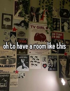 a wall covered in posters and stickers with the words oh to have a room like this