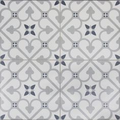 an artistic tile design in grey and white, with hearts on the middle one side