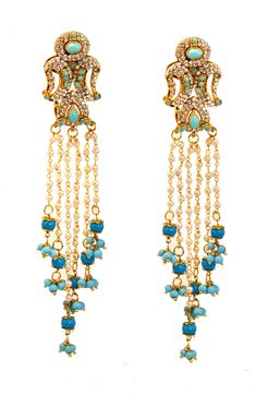 You are looking at beautiful hand crafted Victorian Turquoise Blue and gold jhumka chandelier earrings. It took us 3 months to create the look and translate it into this design. ** A one of a kind piece inspired by the Royals fused with the Victorian styling. ** A very rare find ** 18 K Gold plated . ** Traditional Indian Jewelry. **Length- 4 inches  ** Gold, Turquoise & Pearl bridal earrings These earrings will be shipped with delivery confirmation They come in a individual gift bag or gift box.   Go back to Storefront Taneesijewelry.etsy.com  View my Entire CHANDELIER EARRING Collection at  https://www.etsy.com/shop/taneesijewelry?section_id=13293573 Thank you for your Love & Support Traditional Dangling Beads Earrings For Reception, Elegant Turquoise Kundan Earrings, Bohemian Peacock Design Earrings For Wedding, Blue Bridal Earrings With Latkans, Celebration Stone Work Chandelier Earrings, Blue Kundan Chandelier Earrings For Wedding, Turquoise Kundan Earrings For Wedding, Bohemian Chandbali Chandelier Earrings For Wedding, Bohemian Peacock Design Danglers For Wedding