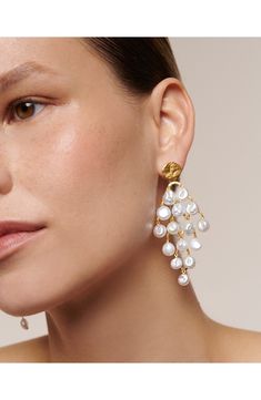 Tiers of keshi pearls bring milky shine and playful movement to these statement-making drop earrings. Exclusive US retailer 2 1/2" drop Post back Pearl size: 5.5–6mm Keshi pearl/sterling silver/recycled 18k-gold plate Imported This brand is certified with the Butterfly Mark, which identifies luxury brands that adhere to social and environmental best practices This brand meets Nordstrom Responsible Brands criteria: brand adheres to responsible social and environmental practices Summer Statement Earrings, Luxury Earrings, Monica Vinader, Keshi Pearls, Pearl Size, The Butterfly, Luxury Brands, Gold Vermeil, Statement Earrings