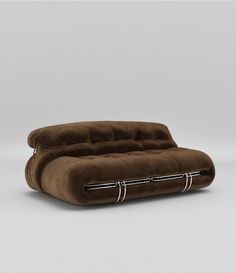 a brown couch sitting on top of a white floor