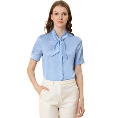 This shirt looks applicable to everyday work clothes in addition to dress-up. The silky fabric shapes this shirt with a tie-neck collared neckline and short sleeves. The curved hem gives it a neat finish over pants. The tie-neck adds casual-inspired sophistication, while soft fabric gives it an elegant, feminine shape. This elegant satin shirt features a tie-bow neck and short sleeves, making it a versatile addition to your wardrobe. Suitable for various occasions including work, office, formal Blue Collared Blouse For Work, Tie Neck Blouse With Button Closure For Work, Elegant Semi-formal Short Sleeve Shirt, Office Shirt With Collared Neckline And Placket, Elegant Short Sleeve Shirt With Placket, Blue Short Sleeve Blouse For Business Casual, Solid Short Sleeve Blouse For Business Casual, Collared Short Sleeve Shirt For Summer Office Wear, Elegant Tie Neck Shirt For Workwear