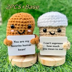 two small crocheted figurines holding signs that say you are my favorite human