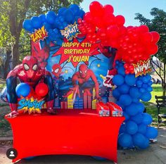 the balloon arch is decorated with balloons and spiderman decorations for a birthday party or baby shower