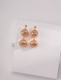 Elegant Matte Gold Earrings For Party, Elegant Matte Gold Party Earrings, Gold Orb Earrings, Luxury Gold Linear Earrings, Gold Spherical Pierced Earrings, Gold Spherical Metal Earrings, Glamorous Gold Linear Earrings As Gift, Glamorous Gold Linear Earrings For Gift, Gold Round Linear Earrings For Party