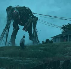 a man standing next to a giant metal horse in the middle of a lush green field