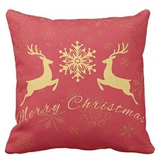 a red pillow with gold reindeers and snowflakes on the front, merry christmas