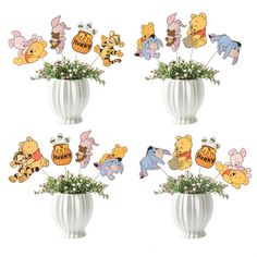 winnie the pooh and friends cupcake toppers in a vase with baby's breath flowers