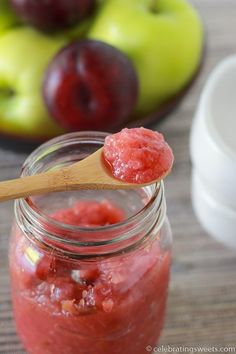 a wooden spoon with some fruit in it