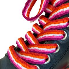 Add a subtle hint of pride to your outfit with our 130cm sunset lesbian flag shoelaces. Vibrant in colour and made with waterproof polyester, these funky lesbian pride laces are perfect for jazzing up your favourite trainers, high tops, or boots. Details: 1 Pair of matching shoelaces 130cm Long x 1cm Wide 100% Polyester Clear plastic aglets Waterproof - perfect for the British weather! Featuring the oranges, white, and pinks of the community lesbian flag Lesbian Flag Accessories, Lesbian Boots, Indie Lesbian Outfits, Lesbian Flag Outfit, Lesbian Pride Outfits, Lesbian Clothes, Pride Shoes, Flag Outfit