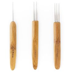 three different types of wood carving tools on a white background, one is made from bamboo and the other has metal tips