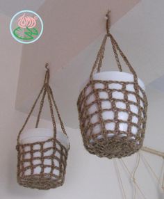 two baskets hanging from the ceiling with rope