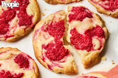 raspberry cheesecake cookies are shown on a baking sheet