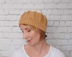 a woman wearing a knitted beanie hat