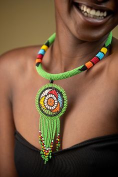 Unique African Maasai Handcrafted Beaded Necklace with an Elegant Look and Brilliant Finish. **GET FREE SHIPPING FOR ADDITIONAL ITEMS PURCHASED. Yes, Buy Multiple Items and pay shipping for 1 item only- The rest ships Free. (No Limits on the number of Multiple items). With a faster delivery time of 3 days via DHLExpress, Worldwide. Ordinary/Standard Shipping also available upon request. We Custom Make to Suit Your Taste. Available In All Colors and Sizes. For wholesale please chat me up for disc Green Bohemian Choker For Festivals, Traditional Green Beaded Necklace For Festival, Traditional Green Beads For Festival, Bohemian Green Choker With Colorful Beads, Bohemian Round Beaded Chain, Green Tiny Beads Necklace For Festival, Green Dangling Beads For Festival, Artisan Green Necklaces With Dangling Beads, Bohemian Green Beaded Necklace With Beaded Chain