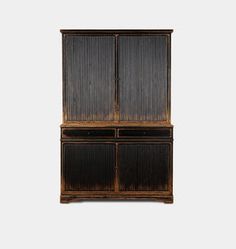 an old wooden cabinet with two doors