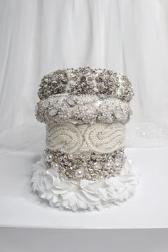 a stack of bracelets sitting on top of a white table