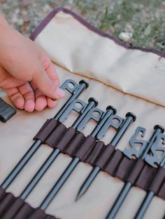 there are many different types of scissors on the table with it's handles open