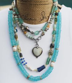 @paomar.jewelry designs with our classic Rondelle Recycled Glass Beads in such a stunning way! 🔷🔹 I love how she mixed Amazonite, Pearls, Brass Donut, and Roman Glass Beads into this layer necklace concept. 🌊
#TheBeadChest #RecycledGlassBeads #Gemstones #Beads #Necklaces #Jewelry #JewelryDesigner Amazon Tribe, Spring Necklace, Warrior Women, Glass Bangles, Recycled Glass Bead, Layer Necklace, Roman Glass, The Warrior, Necklaces Jewelry