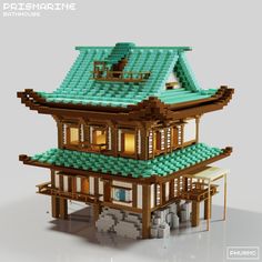 an image of a building made out of legos that is in the shape of a house