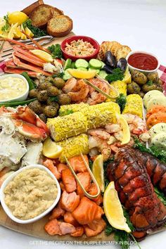 a large platter filled with different types of seafood